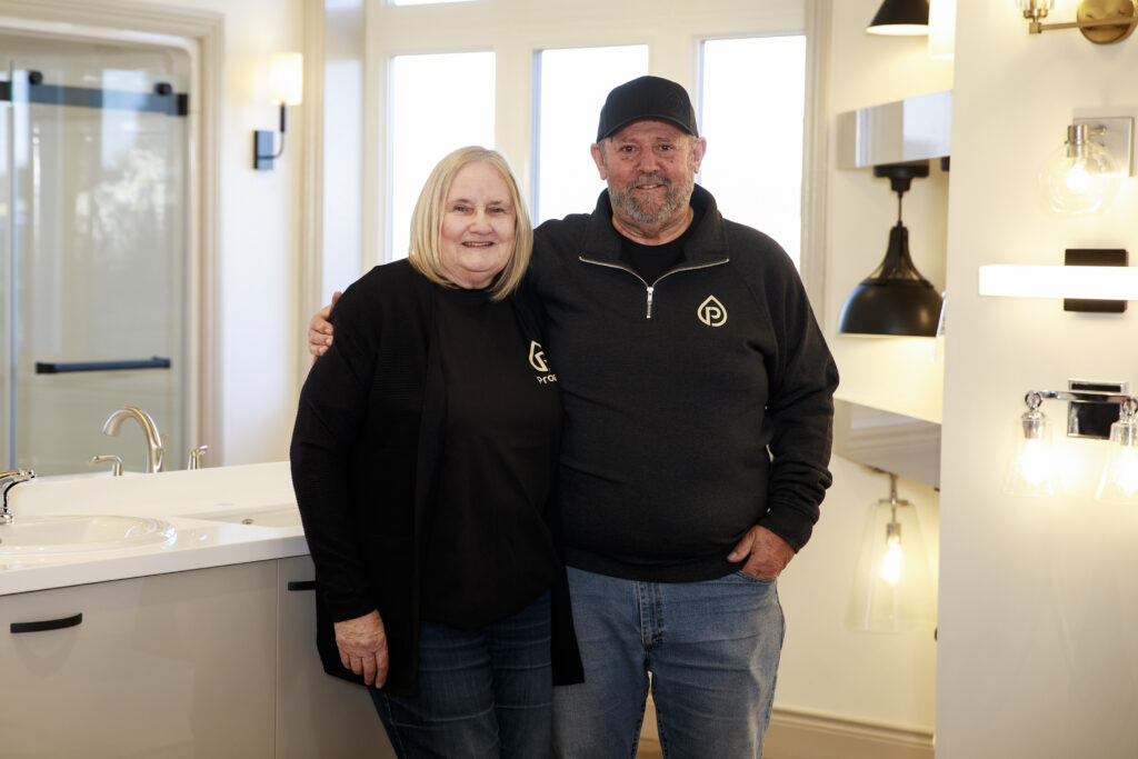 Previous owners of Prouse company Bob and Deb standing in new showroom